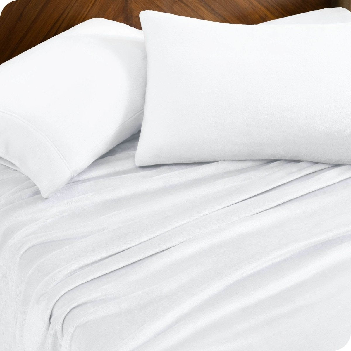 A sheet set and matching pillowcases on a bed.