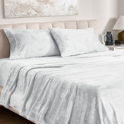 Microplush sheet set on a bed.