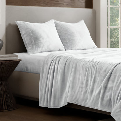 Microplush sheet set on a bed.