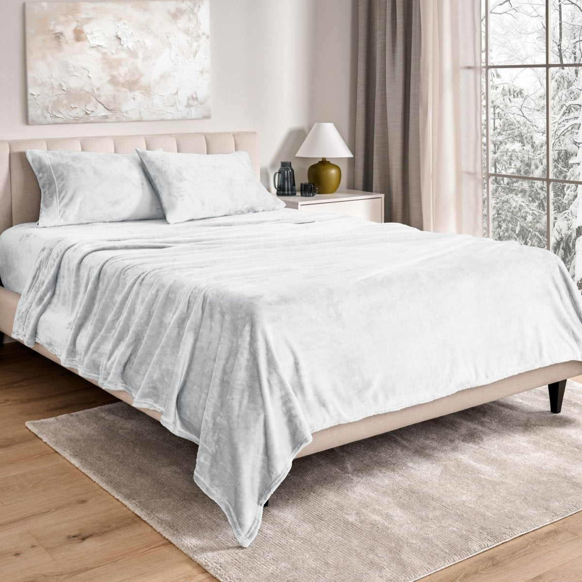 Neatly made bed in a well-lit bedroom.