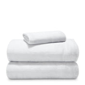 Stack of microplush sheets on a white background