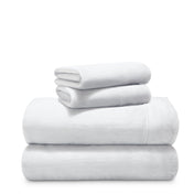 Stack of microplush sheets on a white background