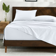 Bedroom scene with organic cotton sheets and pillowcases on a bed