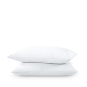 Two pillows stacked on a white background