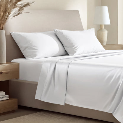 Sateen bedding set including a fitted sheet and two matching pillowcases on a bed.