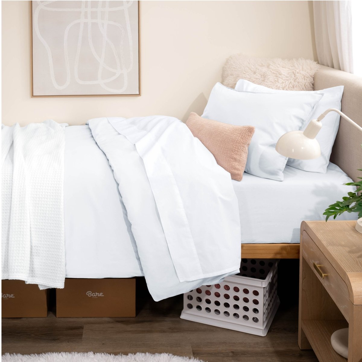 Bed with percale bedding in a dorm room setting