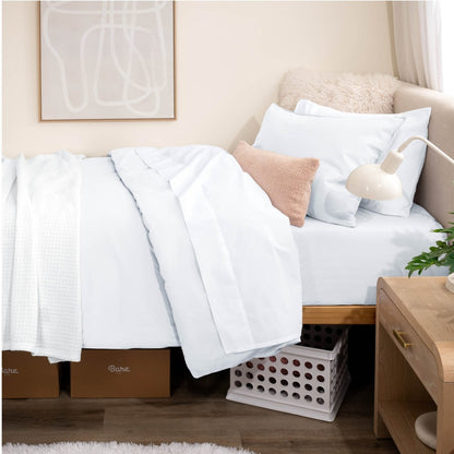 Bed with percale bedding in a dorm room setting