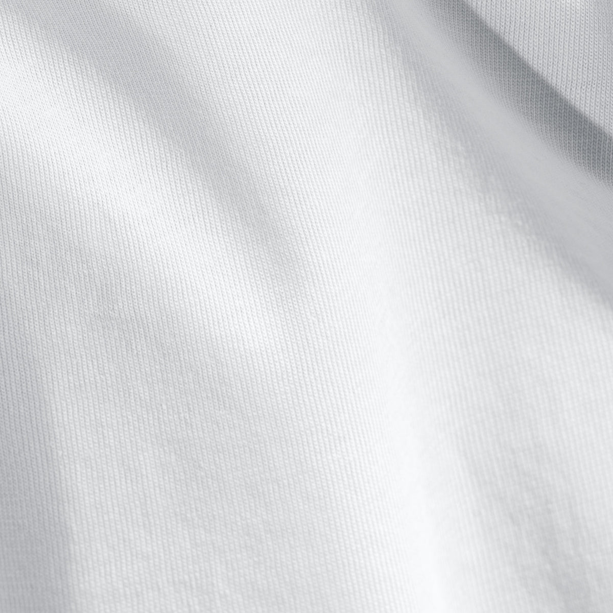 Close-up of organic cotton jersey fabric with subtle texture