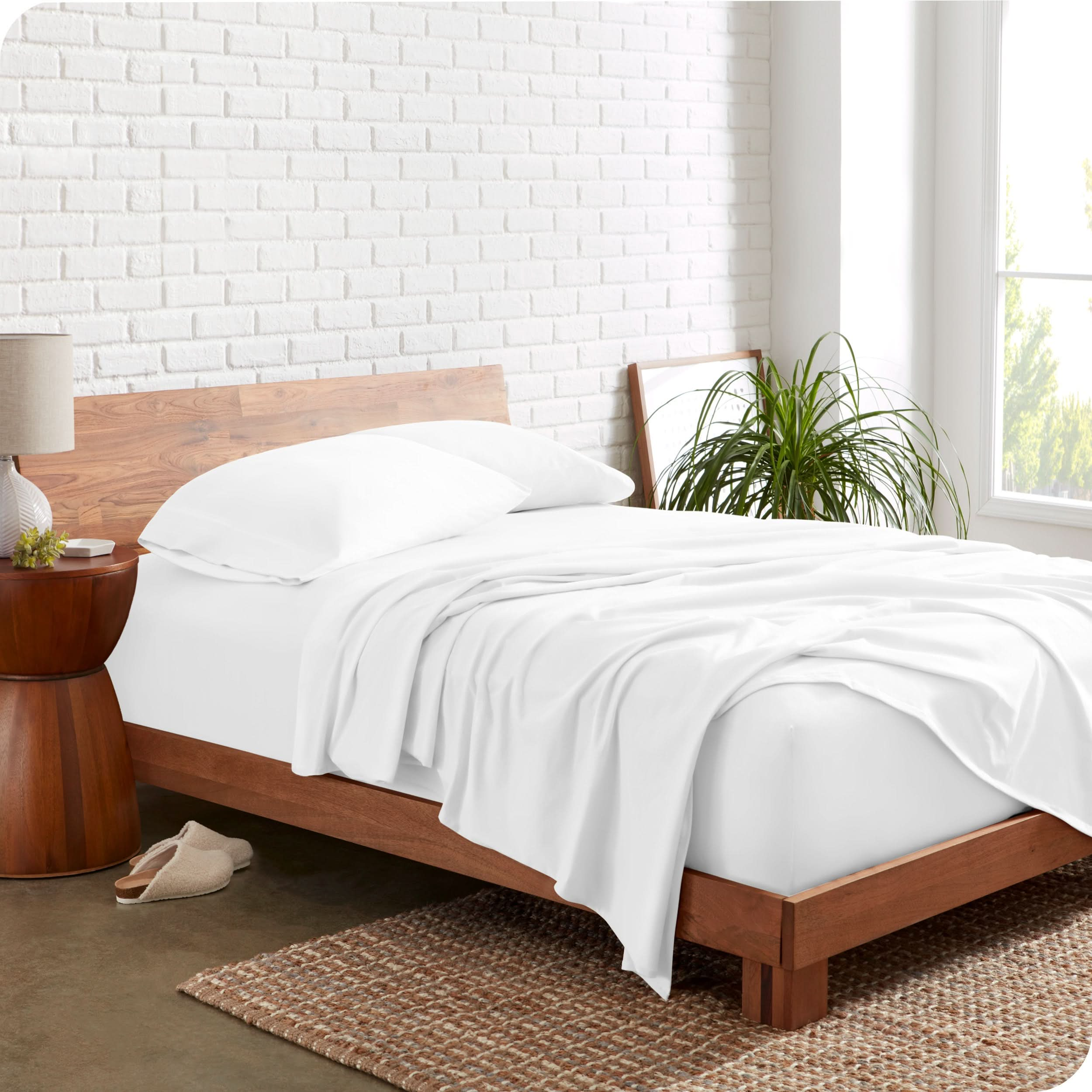 The side view of a bed made with organic cotton jersey sheets