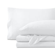 Set of organic cotton jersey sheets on a white background