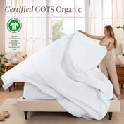 A woman is making a bed with organic cotton percale sheets