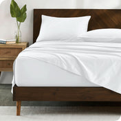 Modern wood bed made with percale sheet set