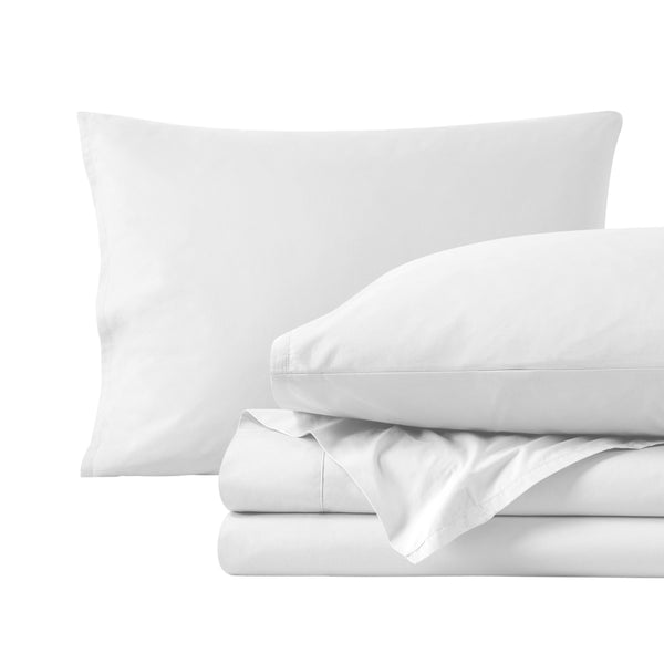 Percale sheets folded and matching pillowcases with pillows in them