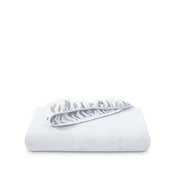 Polar fleece fitted sheet folded on a white background