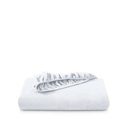 Polar fleece fitted sheet folded on a white background