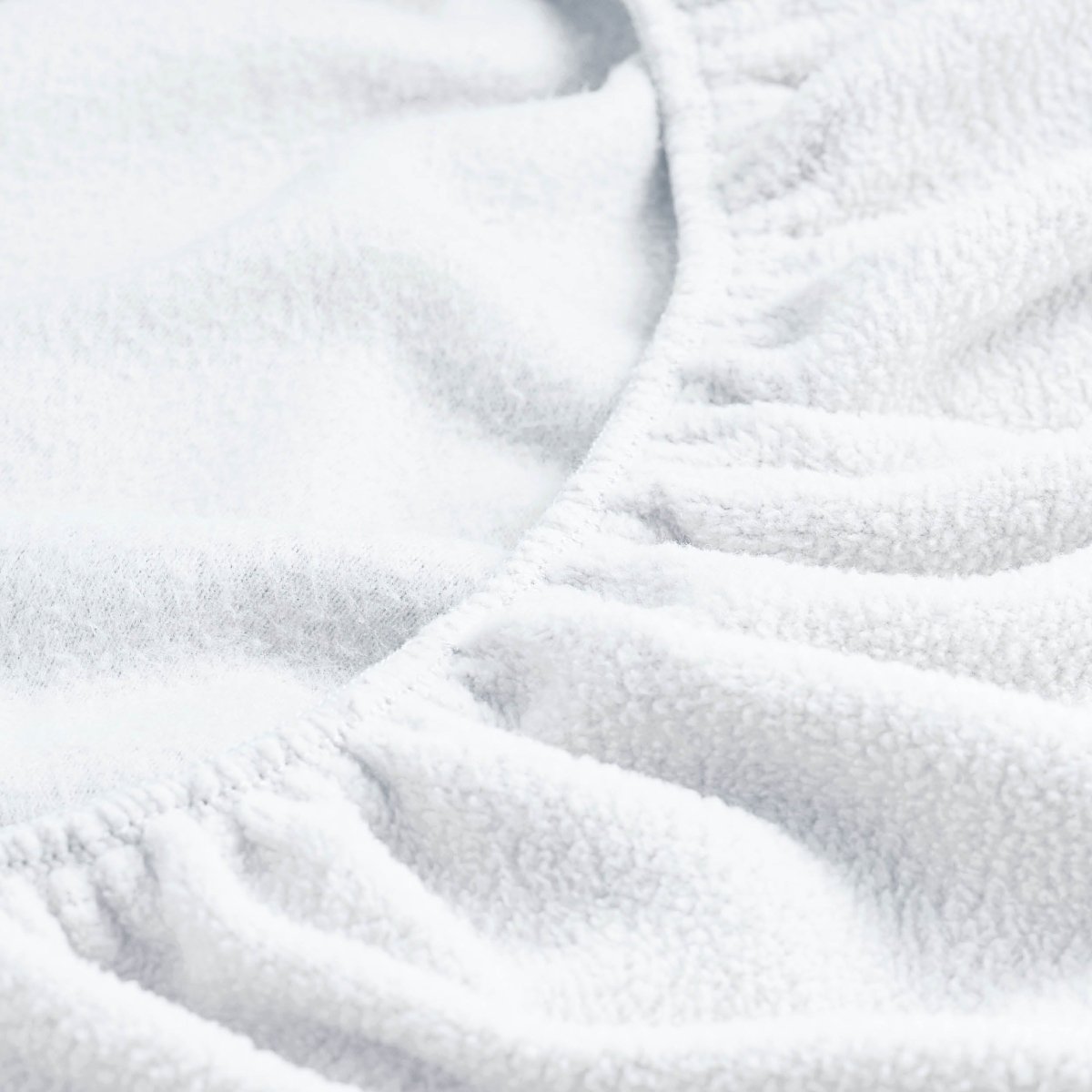 Close-up of a fitted sheet with all around elastic