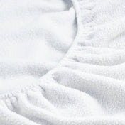 Close-up of a fitted sheet with all around elastic