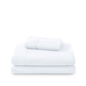 Polar fleece sheets and pillowcases folded and stacked on a white background