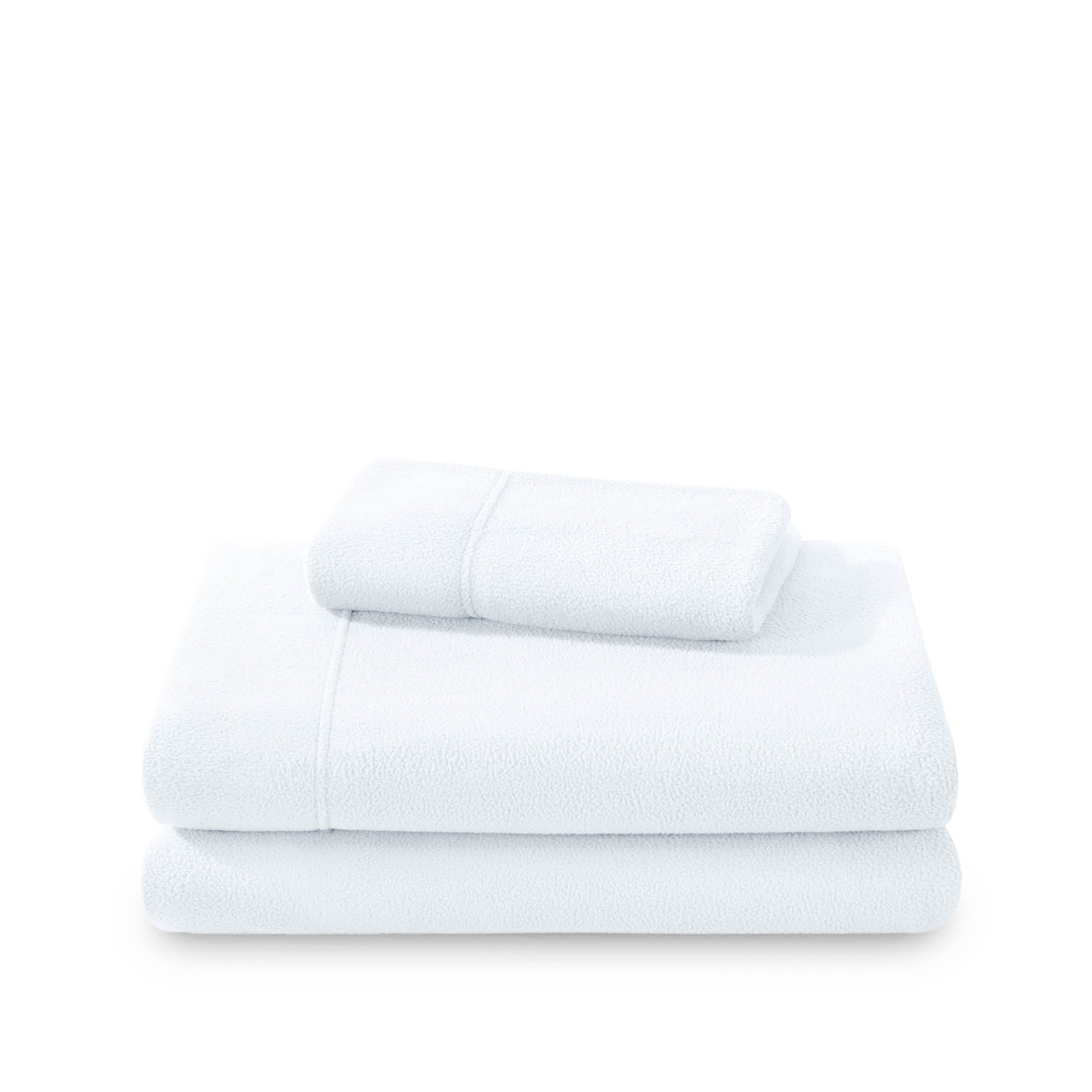 Polar fleece sheets and pillowcases folded and stacked on a white background