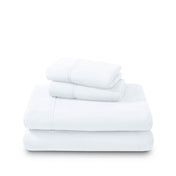 Polar fleece sheets and pillowcases folded and stacked on a white background