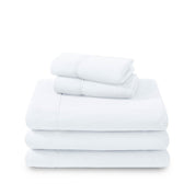 Polar fleece sheets and pillowcases folded and stacked on a white background