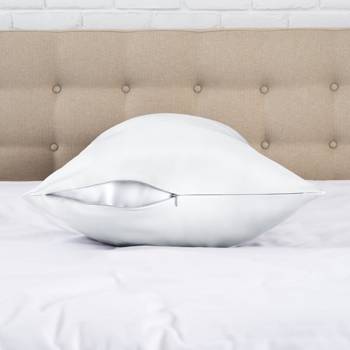 Zipper closure satin pillowcase on a bed