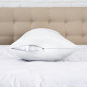 Zipper closure satin pillowcase on a bed