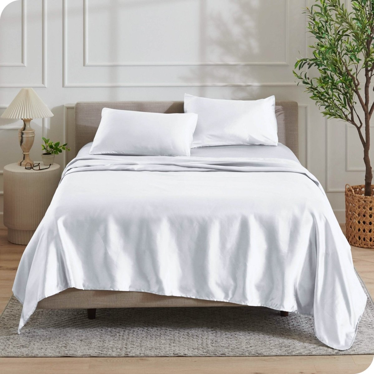 Satin sheets drapped over a mattress