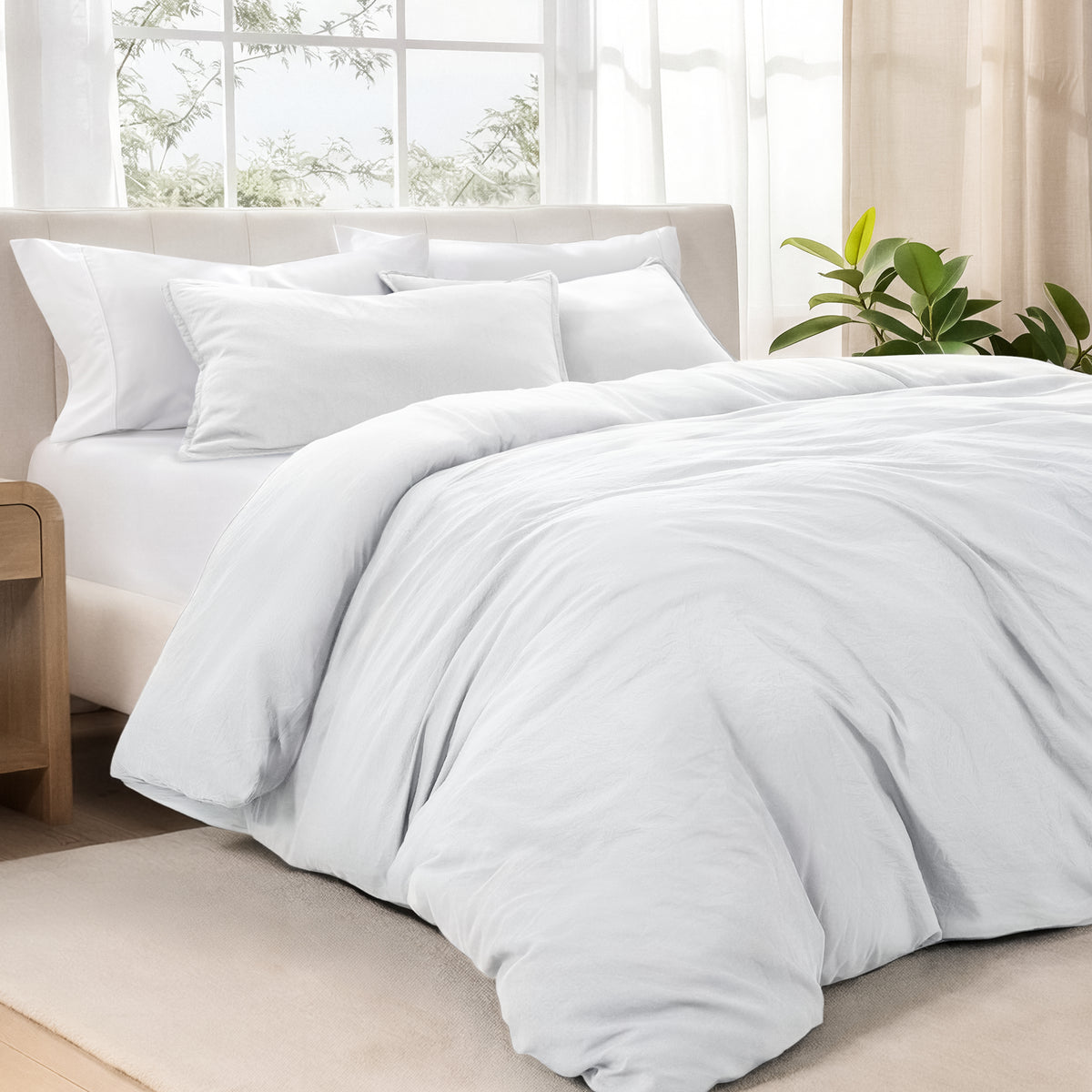 Bedding set on a bed in a bright room with natural light