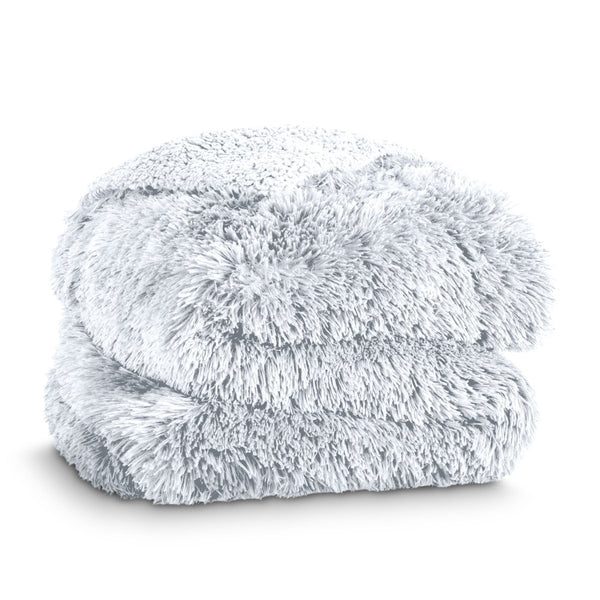 A shaggy faux fur blanket folded