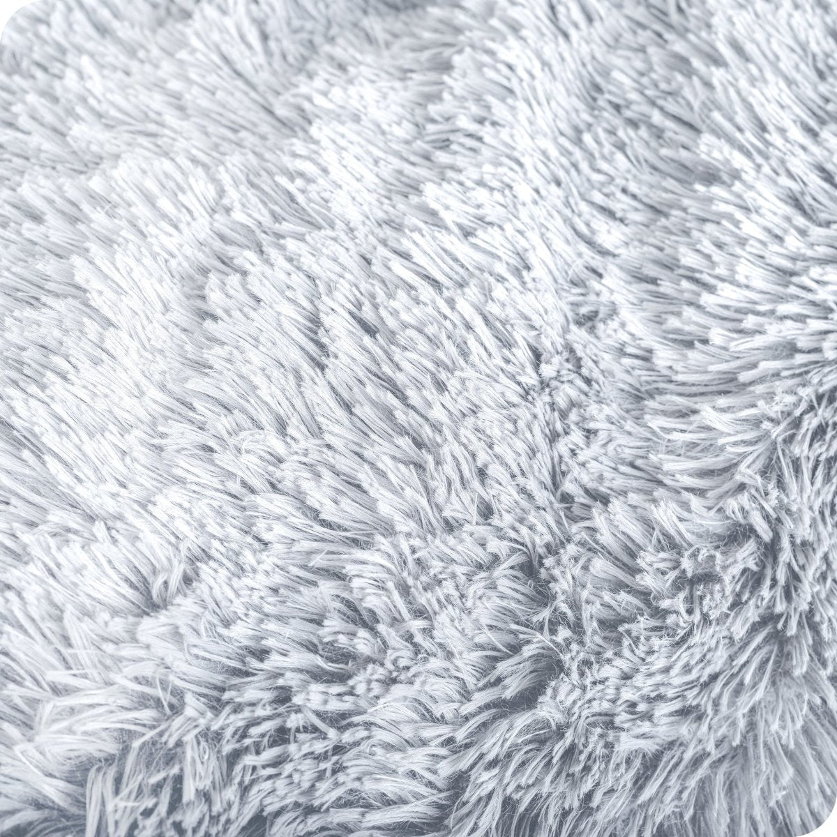 Close up of the soft texture of a shaggy faux fur sherpa blanket