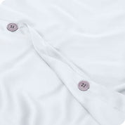 Close up of the buttons on a TENCEL™ duvet cover