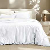 Bedding set on a bed with a lamp in the background