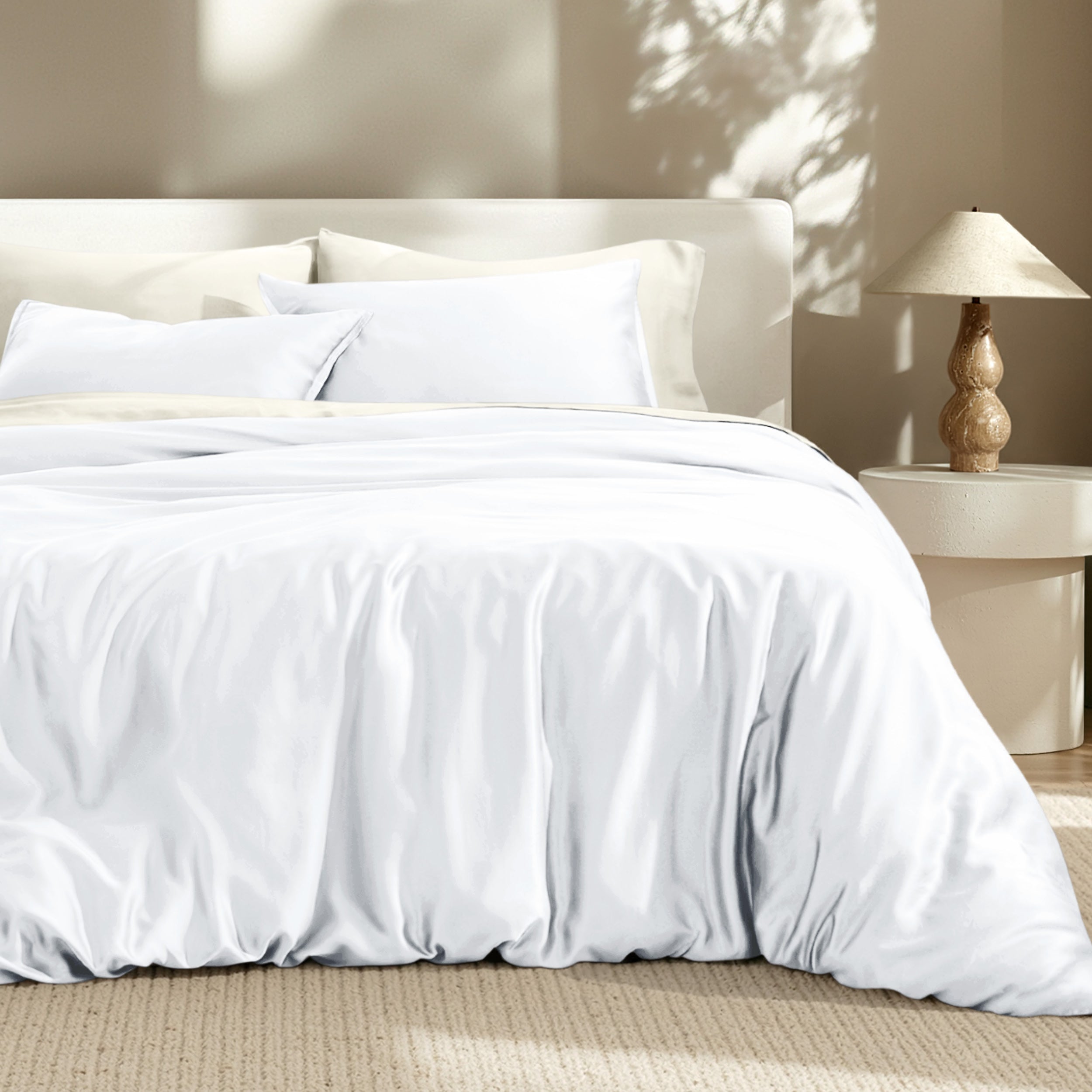 Bedding set on a bed with a lamp in the background