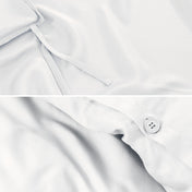 Close-up of duvet ties and button.