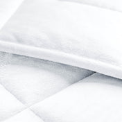 Close-up of a weighted blanket showing the stitching and texture