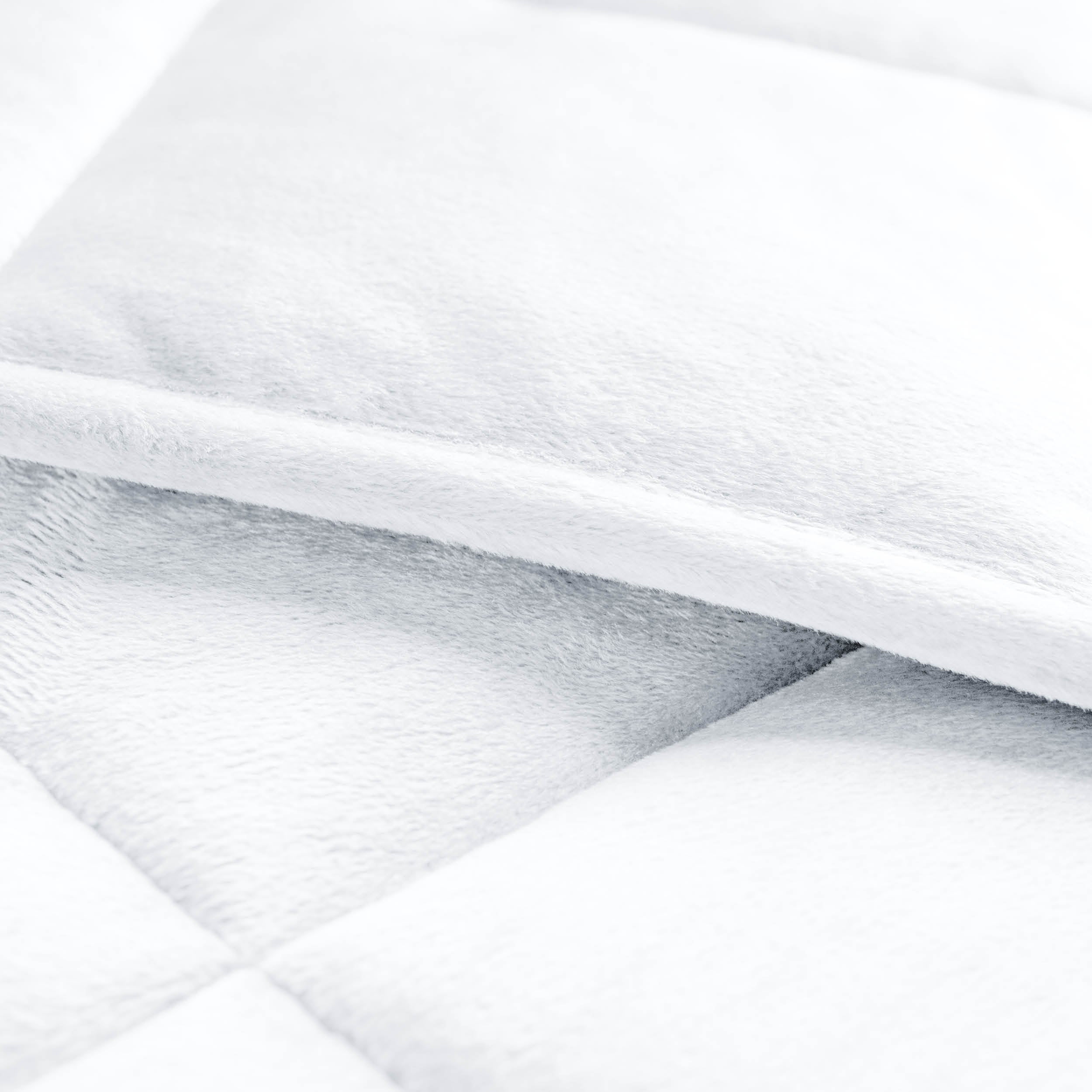 Close-up of a weighted blanket showing the stitching and texture