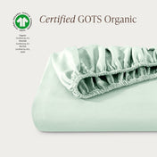 Certified GOTS Organic fitted sheet on a light gray background