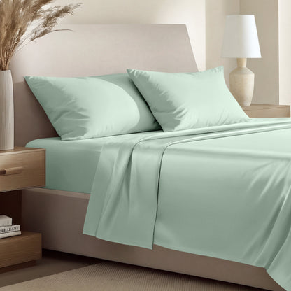 Sateen bedding set including a fitted sheet and two matching pillowcases on a bed.