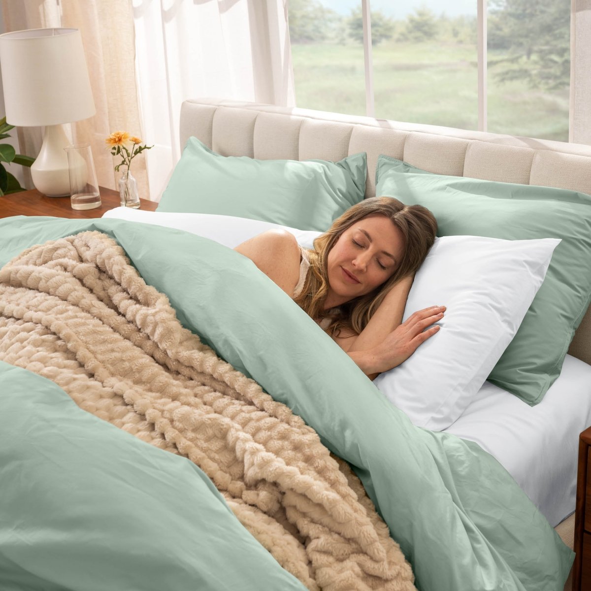 Woman sleeping in a bed with percale bedding