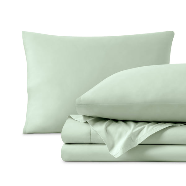 Percale sheets folded and matching pillowcases with pillows in them