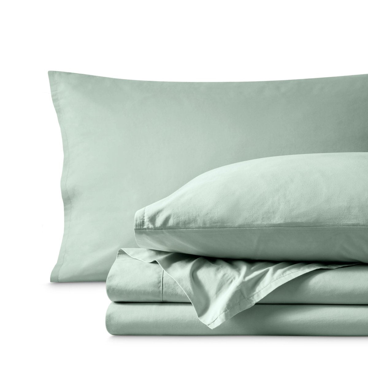 Percale bedding set including pillowcases and folded sheets arranged on a clean white background