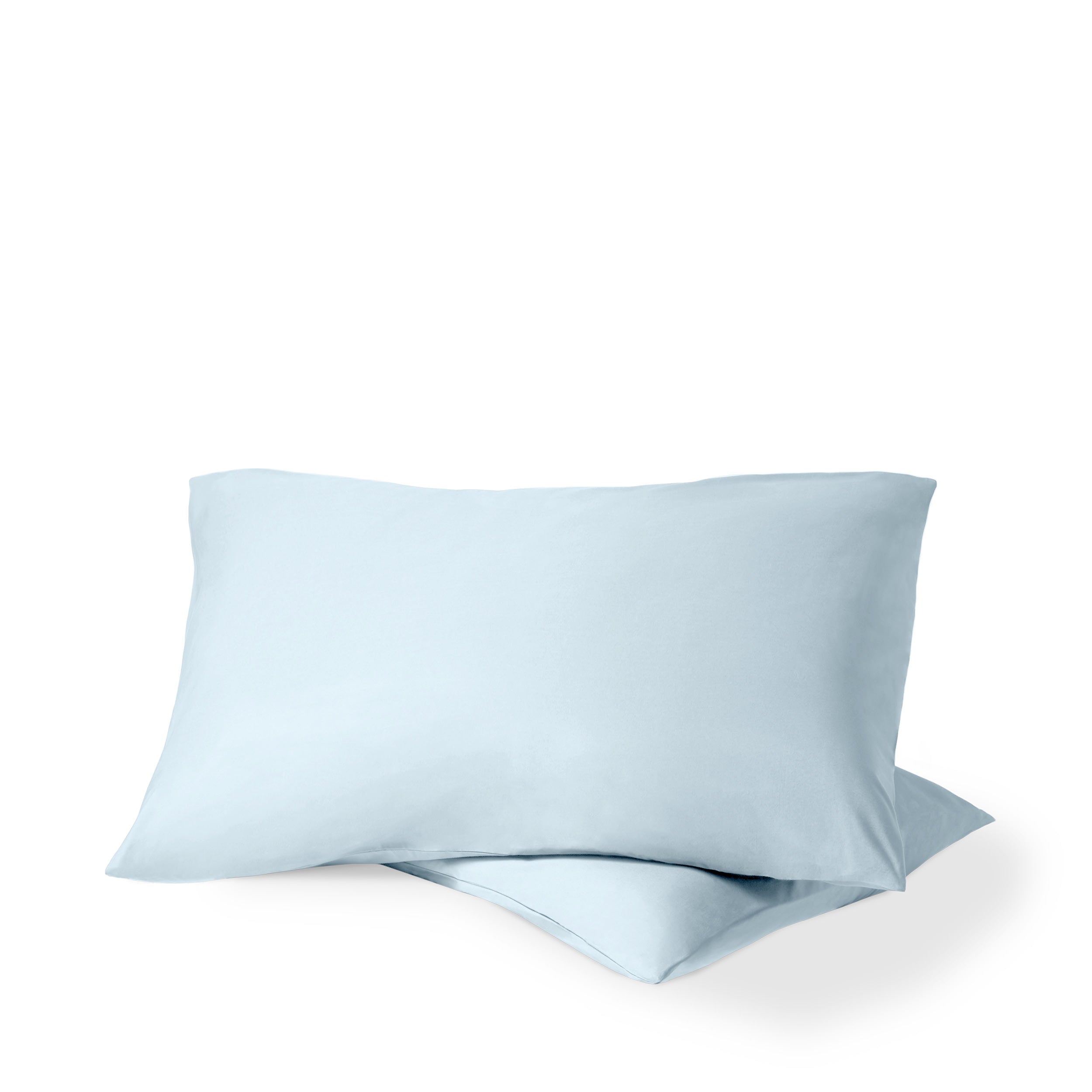 Two pillows with percale pillowcases on them