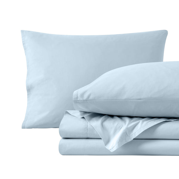 Percale sheets folded and matching pillowcases with pillows in them