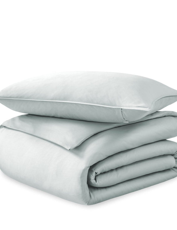 A sateen duvet set arranged in a stack