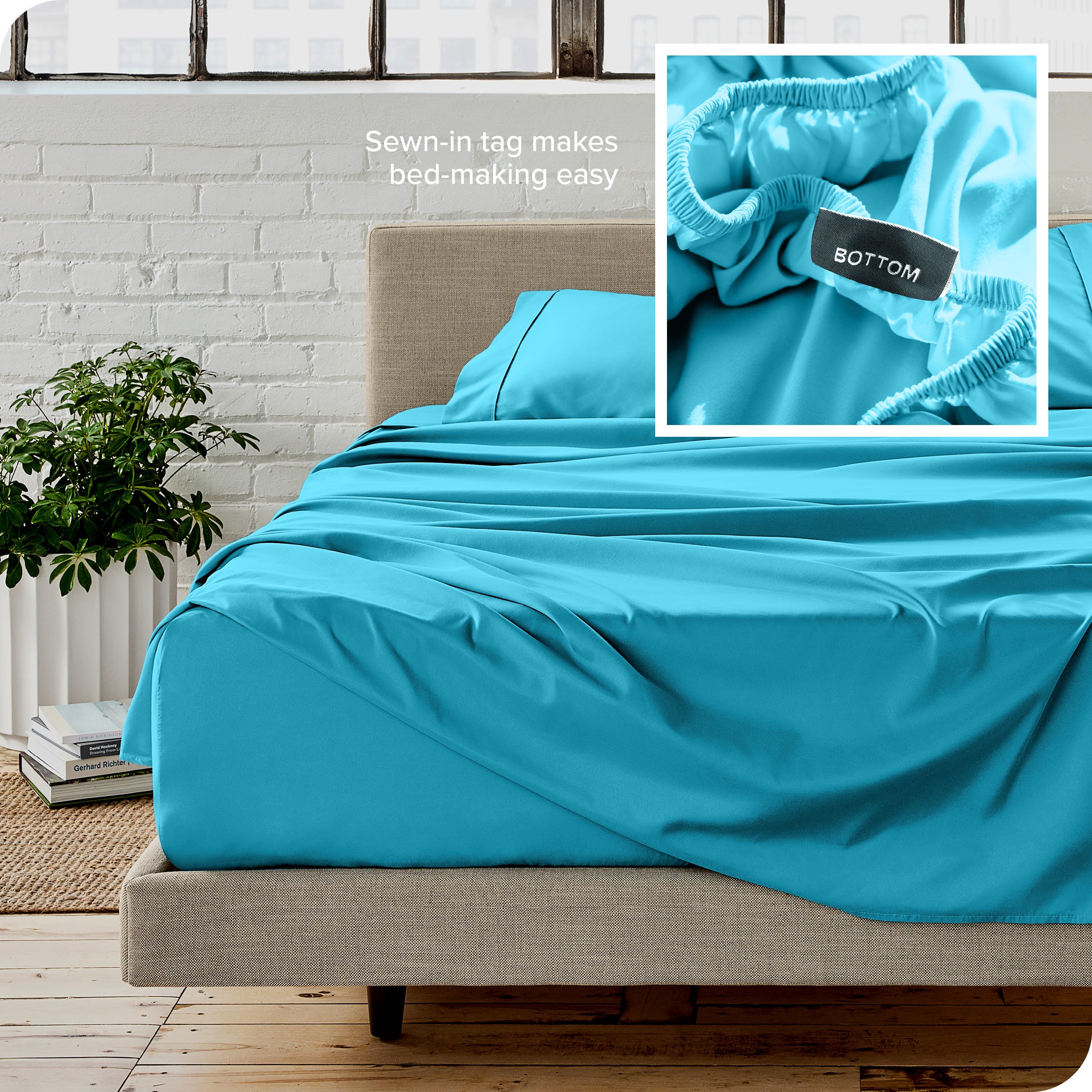 Close up of sewn in tag and matching sheets on a bed