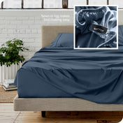 Close up of sewn in tag and matching sheets on a bed