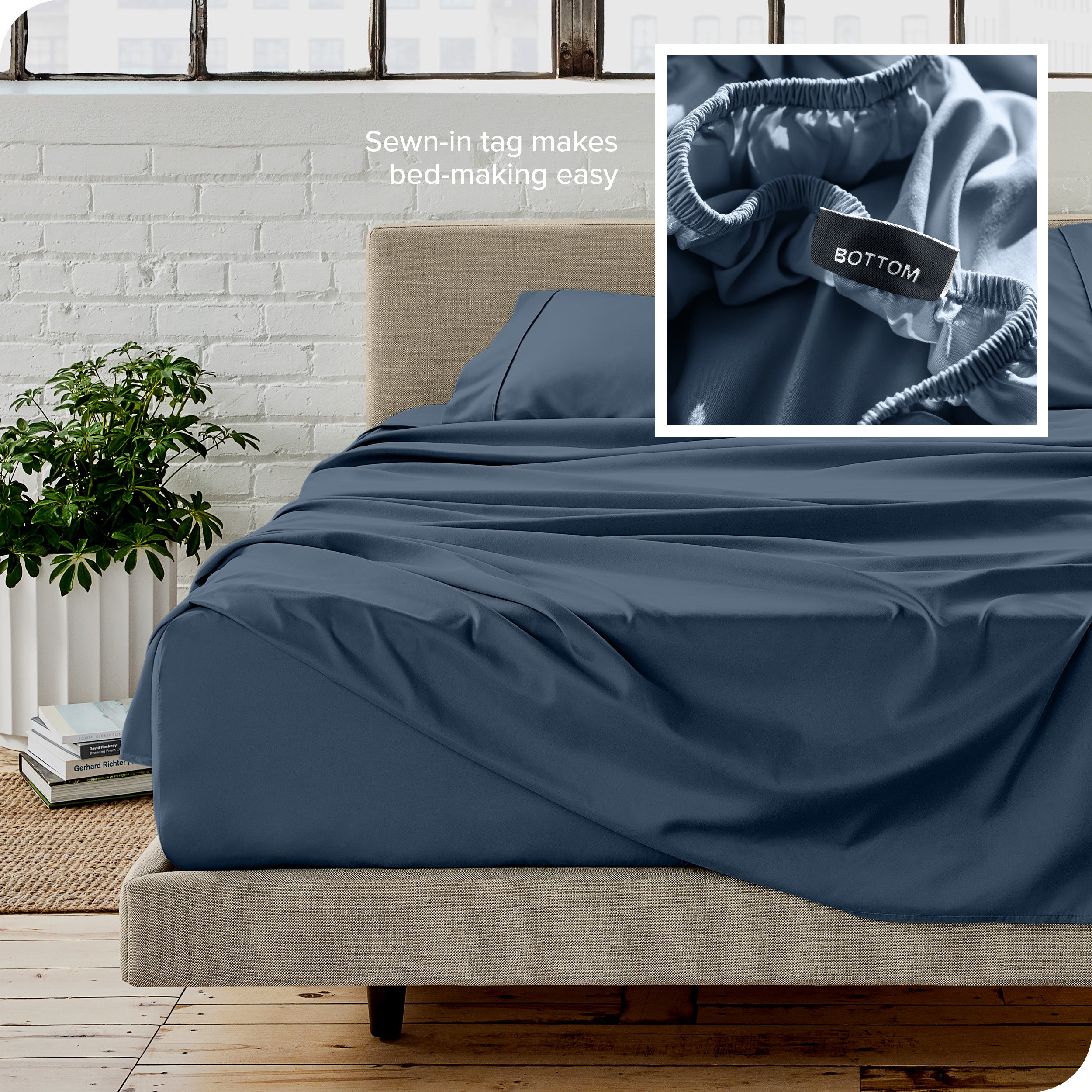 Close up of sewn in tag and matching sheets on a bed