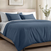 Bed with organic cotton sateen bedding in a bedroom setting.
