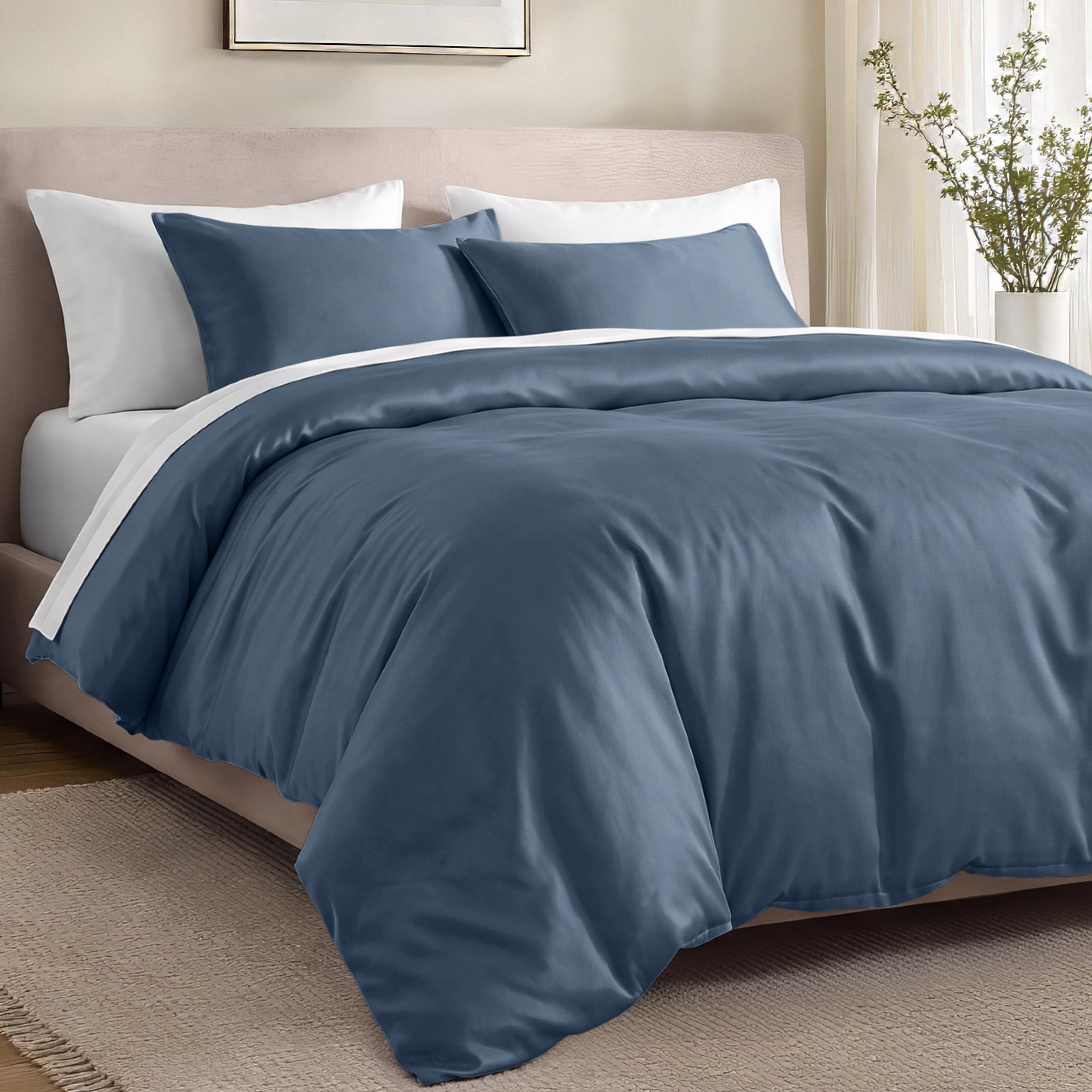 Bed with organic cotton sateen bedding in a bedroom setting.